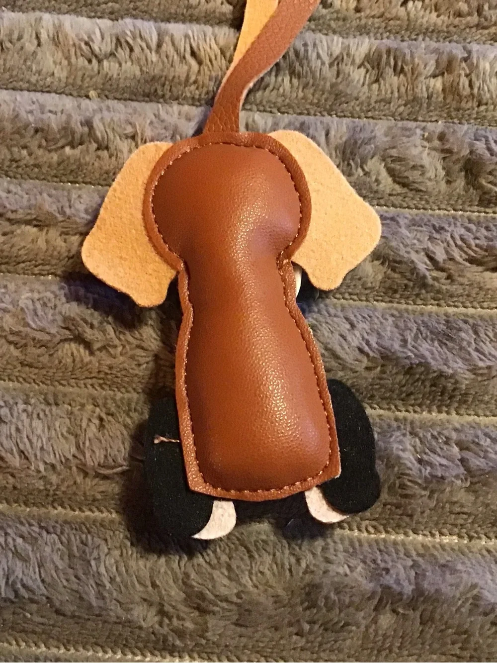 Brown and White Dog-Shaped Pet Tag or Accessory